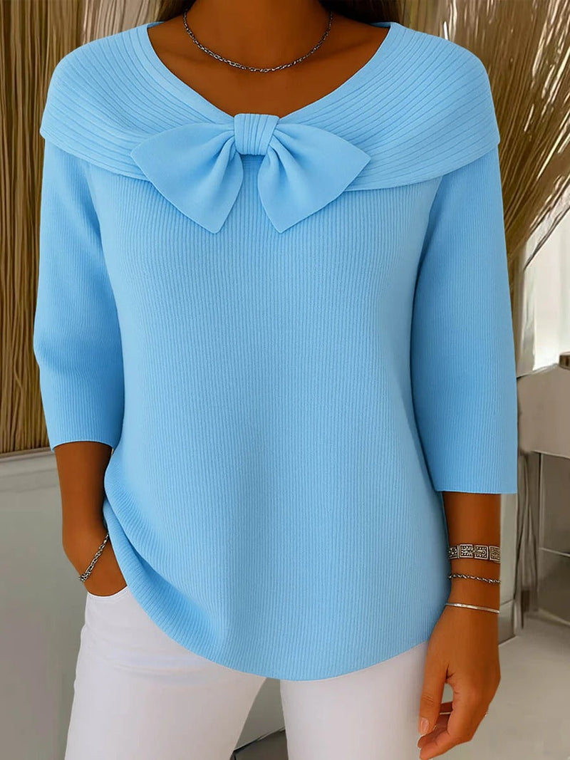 Women’s knitted sweater with a bow