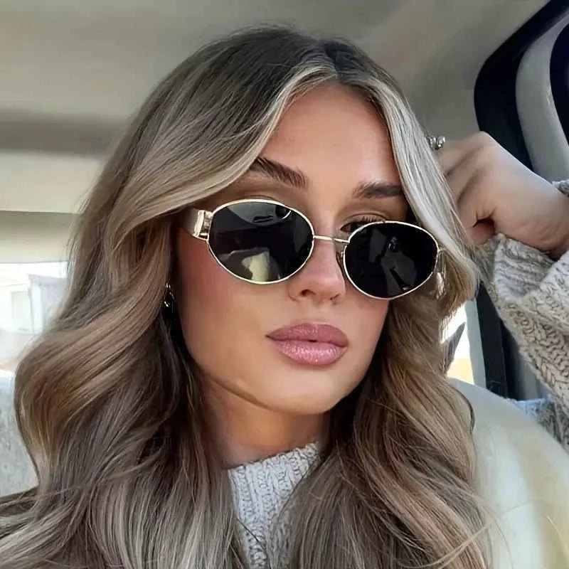 Elina – Oval women's sunglasses with metal frame and dark lenses