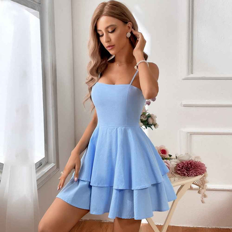 nola – tiered ruffle mini dress with spaghetti straps & back bow